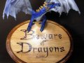 Beware_of_Dragons_Sign_by_mysticalis.jpg